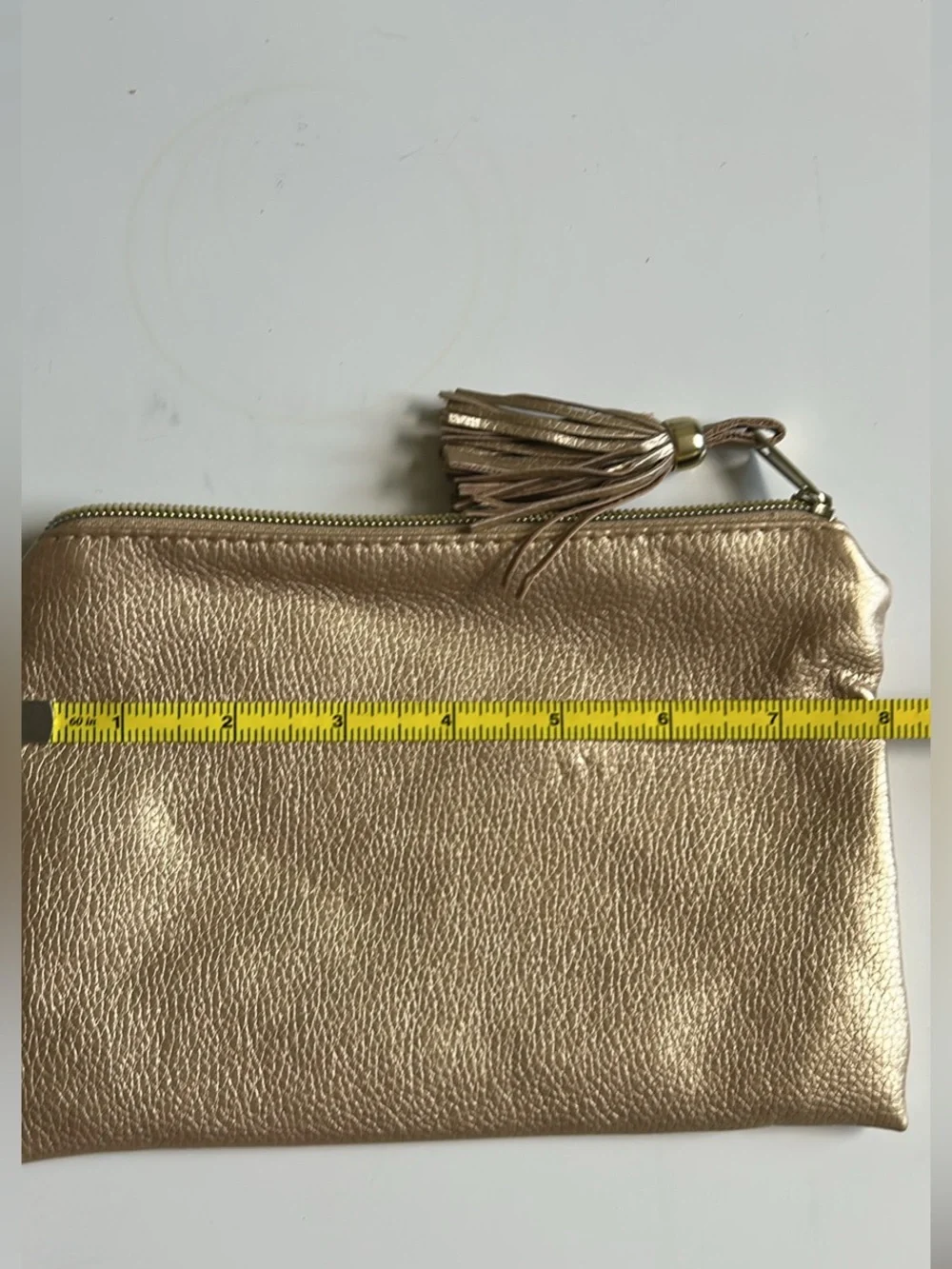 Metallic Gold Wristlet Clutch with Tassel Accent